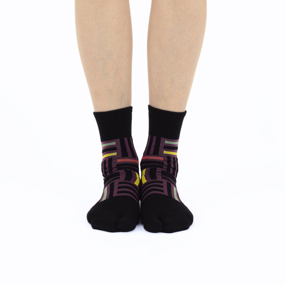 Person wearing long black Tabi Socks " Sankuzushi ", front view
