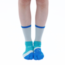 Person wearing long blue Tabi Socks " Enoshim ", front view