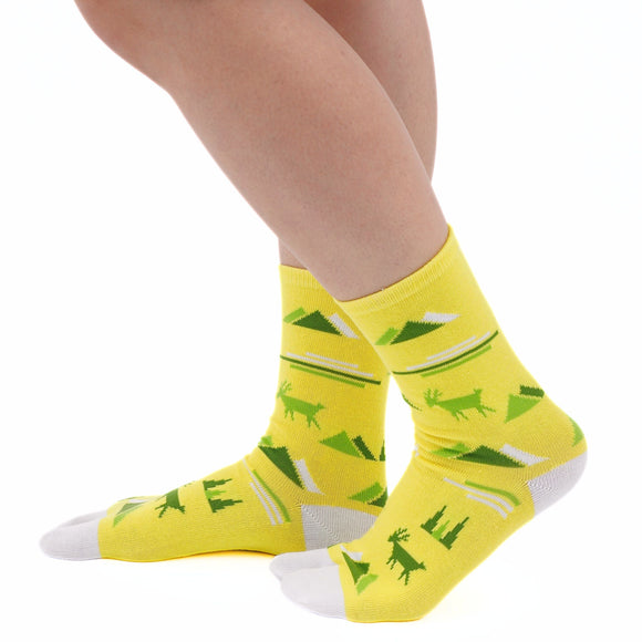 Person wearing long yellow Tabi Socks " Mikasayama ", right side view
