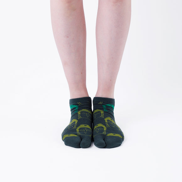 Person wearing short green Tabi Socks " Kamakura Daibutsu ", front view