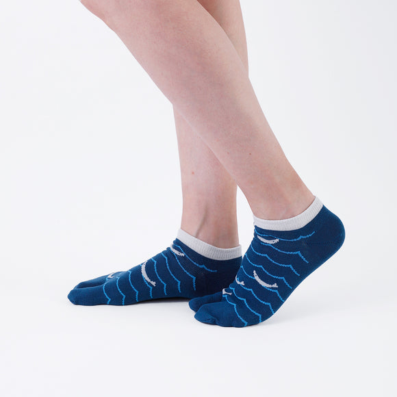 Person wearing short blue Tabi Socks " Shirasu ", right side view