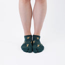 Person wearing short green Tabi Socks " Shika Nozoku ", front view