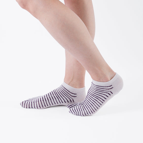 Person wearing short purple Tabi Socks " Hyoshigi ", right side view