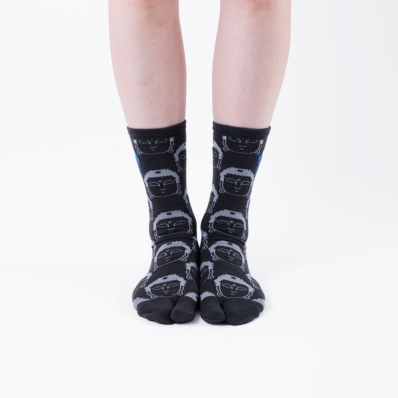 Person wearing long black Tabi Socks " Kamakura Daibutsu ", front view