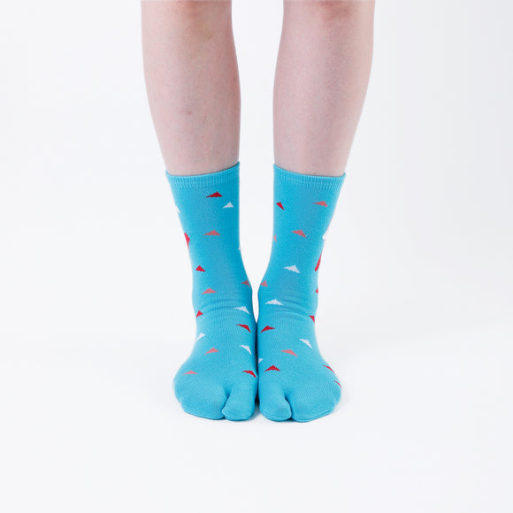 Person wearing long light blue Tabi Socks " Surfer ", front view