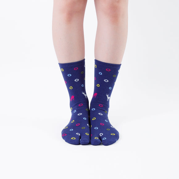 Person wearing long blue Tabi Socks " Shika & Wa ", front view