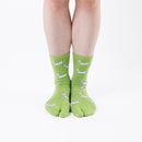 Person wearing long green Tabi Socks " Shika Hashiru ", front view