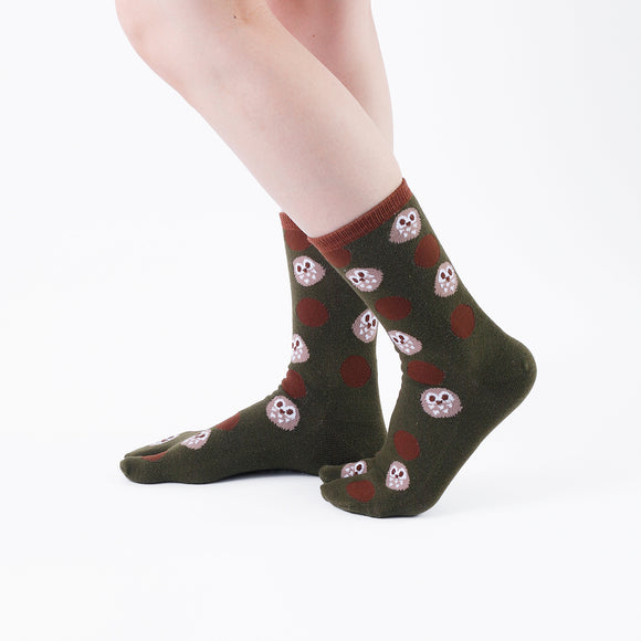 Person wearing long dark green Tabi Socks " Fukuro ", right side view