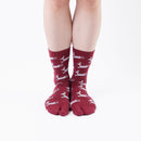 Person wearing long red Tabi Socks " Shika Hashiru ", front view